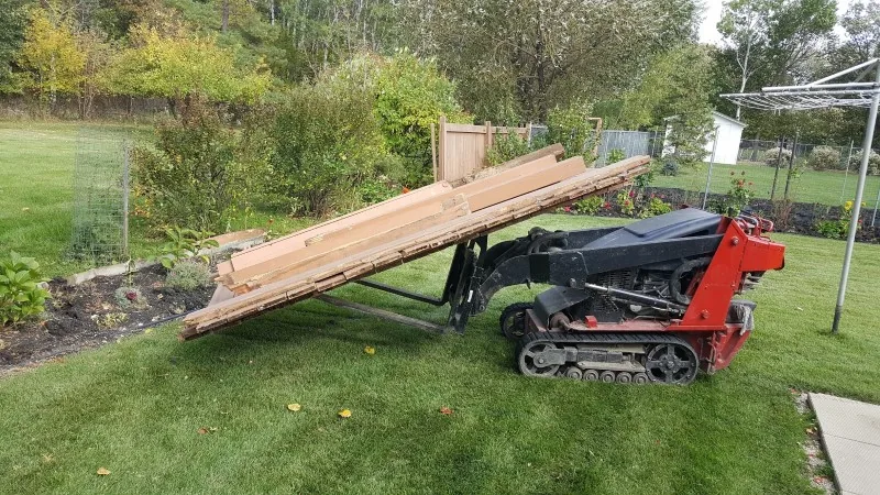 Fence panels being carried out during a residential removal